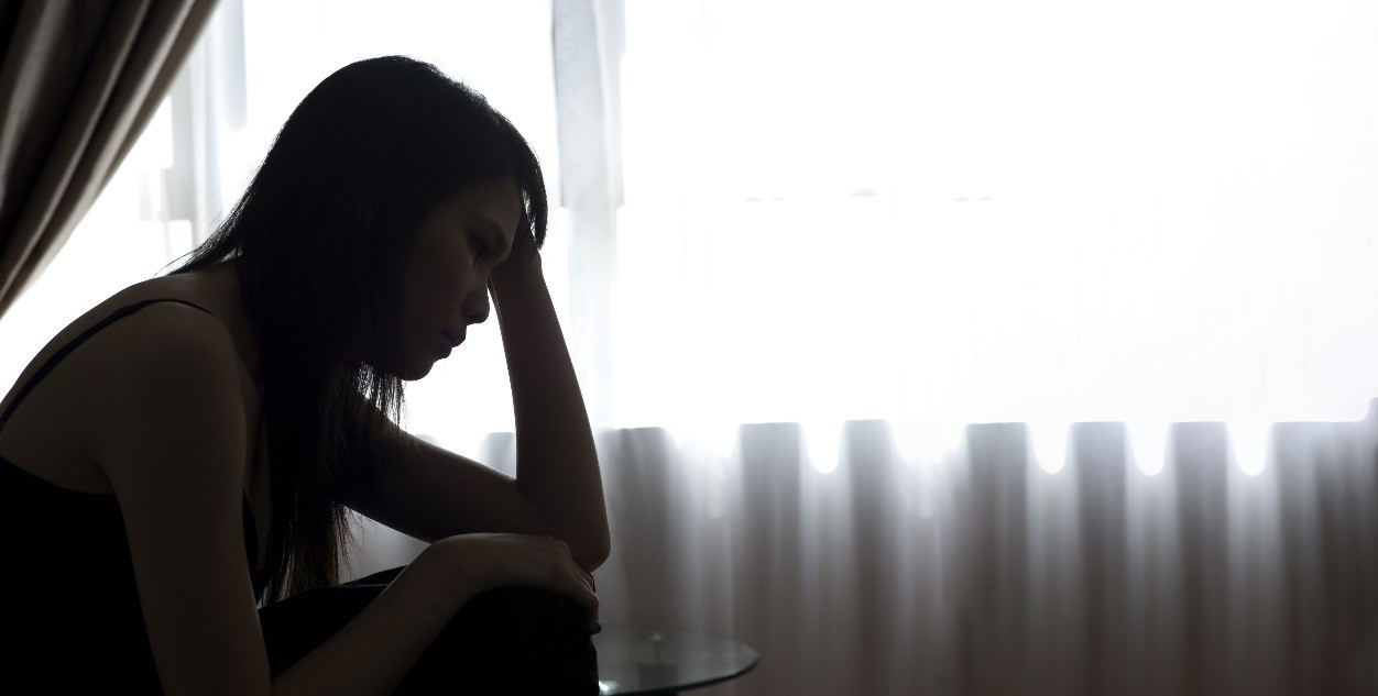 Dreamstime-2 Sad woman in the dark